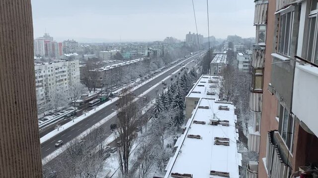 Aerial top view of a city road with traffic in Chisinau, Moldova in winter