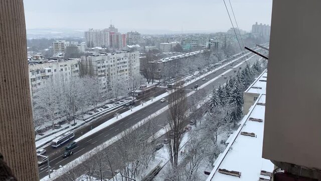 Aerial top view of a city road with traffic in Chisinau, Moldova in winter