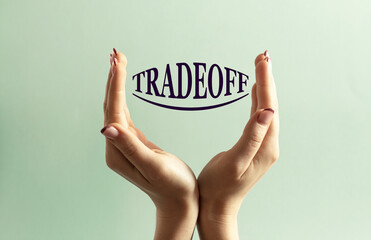 Two women's hands hold the word TRADEOFF against a mint background
