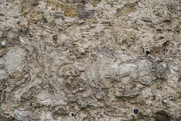 The texture of the old stucco on a brick wall.