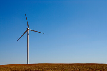 Wind turbine generating electricity on the prairie outside of Amarillo, Texas, USA .