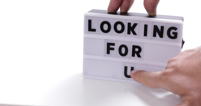we are hiring words on lightnbox on white background flat lay. 