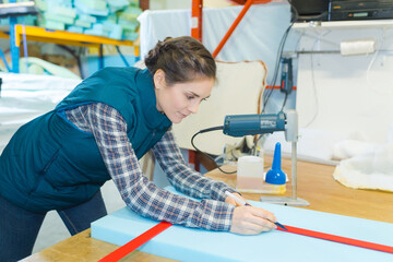worker measuring a foam