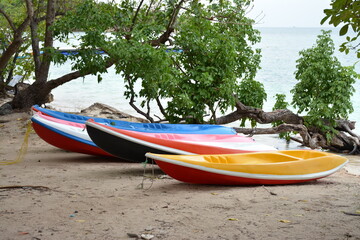 colorful kayaks on the beach, Thai tropical island