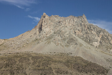 Top of the mountain rounded by deep blue skies