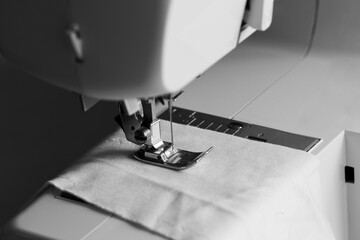 sewing machine in black and white mode, slow fashion and home sewing concept
