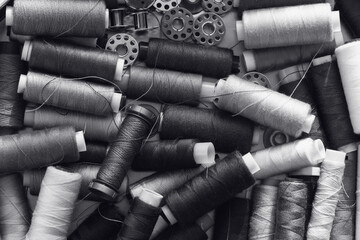 spool of thread in black and white mode. slow fashion and home sewing concept