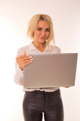 Beautiful girl posing at camera with laptop.