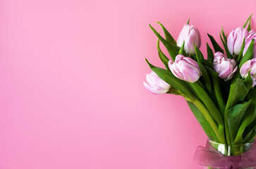 Spring Banner. A bunch of pink tulips in a vase with space for text.