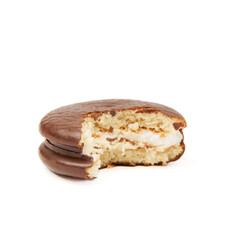 Piece of chocolate cake chokopie bitten off isolated on a white background side view