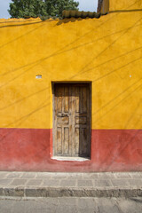 Colorfull door of Mexico, yellow and red.