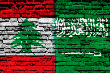 Flag of Lebanon and Saudi Arabia on brick wall