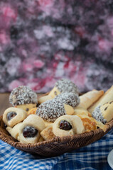 Chocolate and butter cookies in a wooden basket