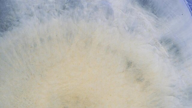 One drop of paint. Macrocosm of liquid ink. Diffusion, psychedelic explosion, movement.