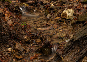 Small creek near Malse river with Doudlebsky waterfall in cold winter color day