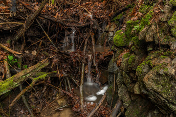 Small creek near Malse river with Doudlebsky waterfall in cold winter color day
