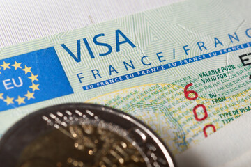 Schengen visa in passport issued by the French embassy. This sample of the Schengen visa has been put into circulation since 2019. Selective focus.