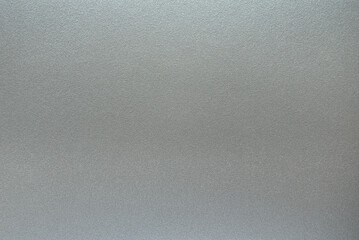 The surface texture of gray metallized plastic, background.