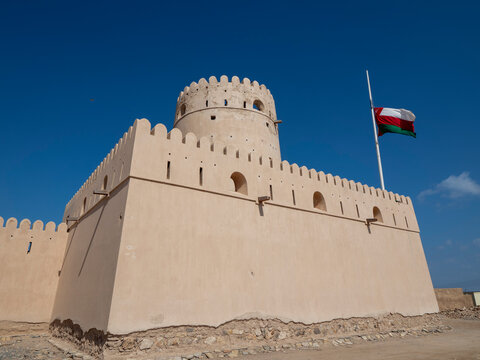 The Omani flag at half mast to signify the death of Sultan Qaboos at Ras Al Had Castle, Sultanate of Oman