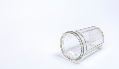 Faceted glass lying on white background