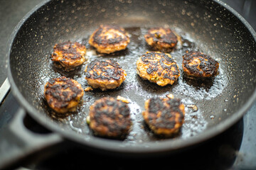 frying pan with mini hamburger meat