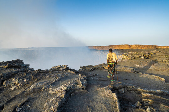 Afar man looking down to Erta Ale volcano caldera, Danakil Depression, Afar Region, Ethiopia