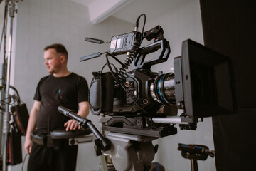Director of photography with a camera in his hands on the set.