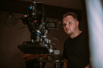 Director of photography with a camera in his hands on the set.