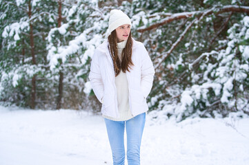 Fototapeta premium beautiful smiling young woman in wintertime outdoor. Winter concept