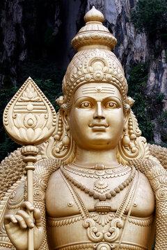 Entrance with the giant statue of Murugan, the Hindu God of War, Hindu Temple and Shrine of Batu Caves, Kuala Lumpur