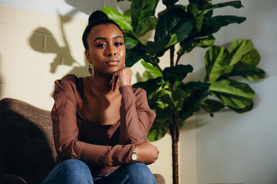 Woman business fashion portrait with clean plant greenery