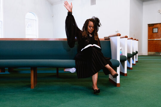 Black woman giving praise and worship to heavenly Father