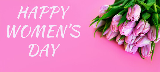 Happy women's day text near a bunch of roses. Banner