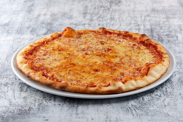 fresh pizza on the white plate
