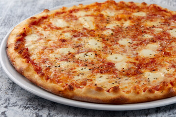 fresh pizza on the white plate