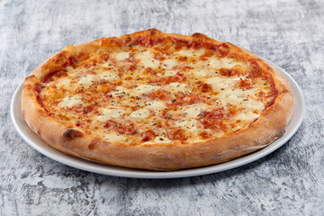 fresh pizza on the white plate