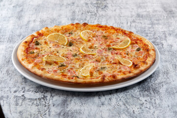 fresh pizza on the white plate