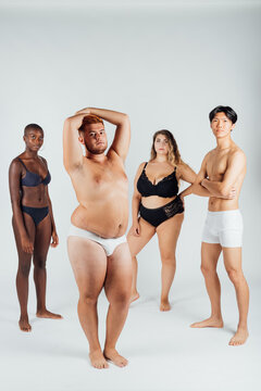 Four young men and women wearing underwear