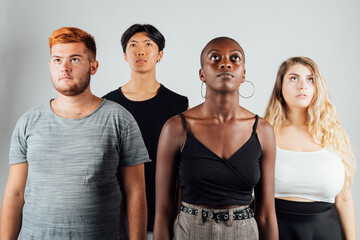 Four young men and women, looking up