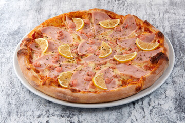 fresh pizza on the white plate