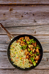 Fried sweet ans sour chicken with steamed rice.