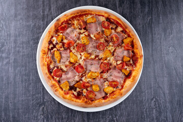 fresh pizza on the white plate