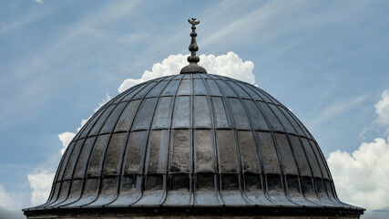 Fototapeta na wymiar A dome from the courtyard of Suleymaniye Mosque throught the domes, Istanbul, Turkey