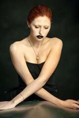 Beautiful fashion woman. Close emotional portrait of a redhead. Selective focus