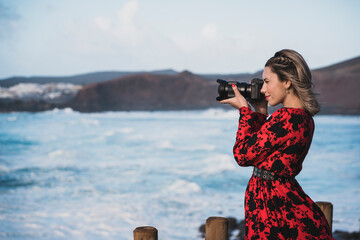 
Young tourist girl visiting the viewpoint of "El golfo" in Lanzarote, Spain