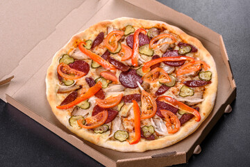 Fresh delicious pizza made in a hearth oven with sausage, pepper and tomatoes