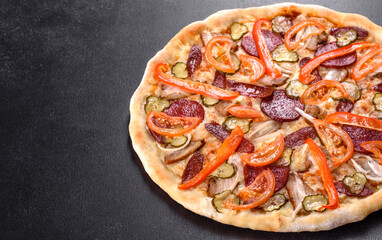 Fresh delicious pizza made in a hearth oven with sausage, pepper and tomatoes