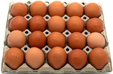 A cardboard box of fresh eggs on a white background