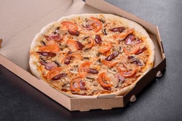 Fresh delicious pizza made in a hearth oven with sausage, pepper and tomatoes