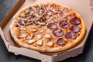 Fresh delicious pizza made in a hearth oven with four types of meat and sausage
